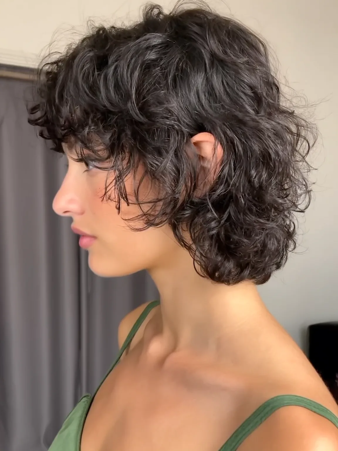 Curly Chin-Length Bob with Rich Espresso Volume